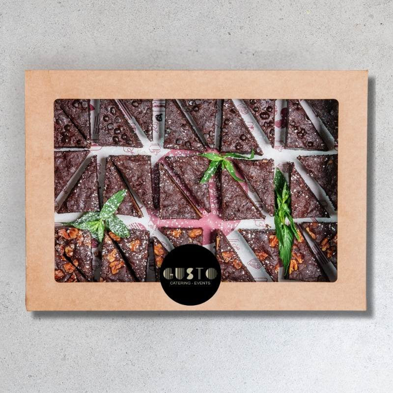 Box of brownies with a visible brand logo on a gray background