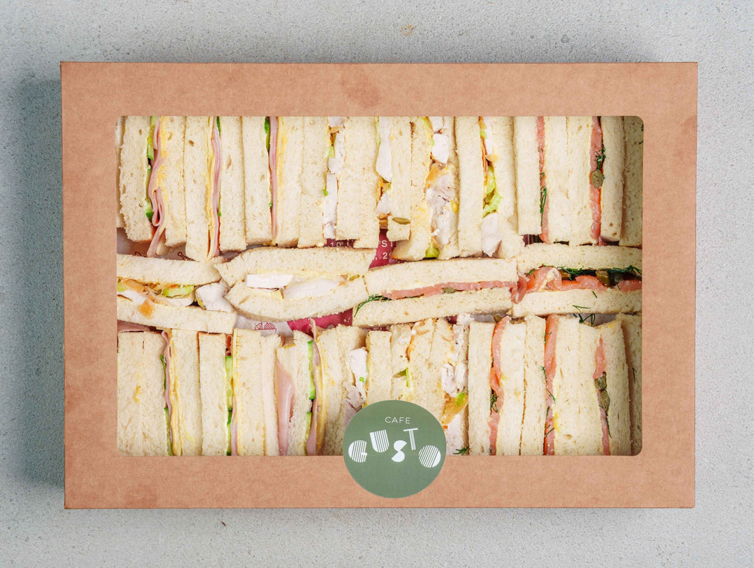 Freshly made sandwiches with smoked salmon, pulled chicken and smoked leg ham for sandwich catering Sydney